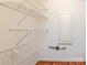 A walk-in closet with white wire shelving and hardwood floors at 5007 Sharon Rd # R, Charlotte, NC 28210