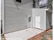 Home exterior with backyard concrete patio and separate entrance at 552 Ridge Ave, Mooresville, NC 28115