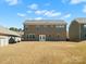 Large backyard with a two-story home, perfect for outdoor activities and entertaining at 5532 Muckross Ln, Fort Mill, SC 29707