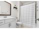 Bright bathroom featuring a white vanity, stylish mirror, and shower with modern fixtures at 5532 Muckross Ln, Fort Mill, SC 29707