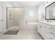 Bathroom with a glass-enclosed shower, soaking tub, and double sink vanity at 5532 Muckross Ln, Fort Mill, SC 29707