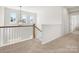 Upstairs hallway with carpet and a lantern pendant light fixture at 5532 Muckross Ln, Fort Mill, SC 29707