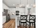 Bright kitchen featuring stainless appliances, white cabinets and bar seating at 5532 Muckross Ln, Fort Mill, SC 29707