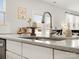 A close up shows the kitchen's sink, countertop and adjacent dining area at 5532 Muckross Ln, Fort Mill, SC 29707