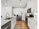 The bright kitchen showcases stainless appliances, a subway tile backsplash and wood floors at 5532 Muckross Ln, Fort Mill, SC 29707