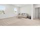 Carpeted living room with a small couch and a large window at 5532 Muckross Ln, Fort Mill, SC 29707