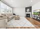 Bright living room featuring a fireplace, comfortable seating, and hardwood floors for a cozy atmosphere at 5532 Muckross Ln, Fort Mill, SC 29707