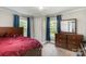 Cozy bedroom with hardwood furniture, closet, and natural light from two windows at 557 Hunter Ave, Kannapolis, NC 28083