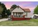 Charming single-story home featuring a welcoming front porch and a well-maintained lawn at 557 Hunter Ave, Kannapolis, NC 28083