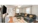Comfortable living room with a large sectional sofa, natural light, and stylish decor at 557 Hunter Ave, Kannapolis, NC 28083