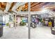 Unfinished basement with exposed ducts, lumber, and a partially visible lawn tractor at 621 N 9Th St, Albemarle, NC 28001