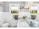 Elegant bathroom features a granite countertop, modern lighting, and a large mirror at 621 N 9Th St, Albemarle, NC 28001