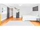 Bedroom with hardwood floors, two windows, and a gray walls with a bed and bookshelf at 621 N 9Th St, Albemarle, NC 28001