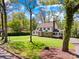 A charming house with a blend of stone and siding, surrounded by beautiful trees and lush greenery at 621 N 9Th St, Albemarle, NC 28001