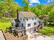 An exterior view of the back of the home featuring a patio, white siding, and a two-car garage at 621 N 9Th St, Albemarle, NC 28001