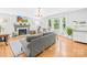 Bright living room featuring a fireplace, hardwood floors, and large windows with natural light at 621 N 9Th St, Albemarle, NC 28001