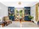 Cozy home office with custom built-in bookshelves and serene view of lush greenery at 621 N 9Th St, Albemarle, NC 28001