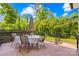 Inviting outdoor patio, perfect for dining al fresco surrounded by lush greenery and blue skies at 621 N 9Th St, Albemarle, NC 28001