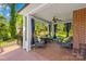Relaxing screened porch with comfortable seating, offering a serene view of the outdoors at 621 N 9Th St, Albemarle, NC 28001