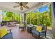 Cozy screened porch with stylish seating, providing a tranquil outdoor living space with view of the landscape at 621 N 9Th St, Albemarle, NC 28001