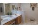 Bathroom boasts double sinks, a decorative mirror, and a glass shower at 6222 Meadow Glen Ln, Harrisburg, NC 28075