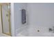 Bright bathroom features a soaking tub and a glass-enclosed shower at 6222 Meadow Glen Ln, Harrisburg, NC 28075