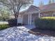 Community clubhouse with stone accents, welcoming entrance, and manicured landscaping at 6222 Meadow Glen Ln, Harrisburg, NC 28075
