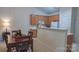 Bright dining area adjacent to the kitchen, perfect for Gathering meals and entertaining guests at 6222 Meadow Glen Ln, Harrisburg, NC 28075