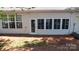 Home exterior featuring sunroom with lots of windows and a door at 6222 Meadow Glen Ln, Harrisburg, NC 28075