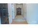 Bright foyer featuring wood flooring, a view into the home and access to other rooms at 6222 Meadow Glen Ln, Harrisburg, NC 28075