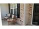 Inviting front porch showcasing chairs for relaxing, brick accents, and a well-manicured exterior at 6222 Meadow Glen Ln, Harrisburg, NC 28075