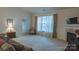 Bright living room with fireplace and large window provides plenty of natural light at 6222 Meadow Glen Ln, Harrisburg, NC 28075