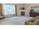 Bright and airy living room boasts a fireplace and large window for natural light at 6222 Meadow Glen Ln, Harrisburg, NC 28075