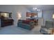 Spacious living room with open floor plan, connecting kitchen and dining areas at 6222 Meadow Glen Ln, Harrisburg, NC 28075