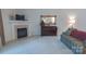 Relaxing living room area with fireplace, piano, and plenty of space at 6222 Meadow Glen Ln, Harrisburg, NC 28075