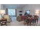 Spacious living room with fireplace, large window, and comfortable seating arrangement at 6222 Meadow Glen Ln, Harrisburg, NC 28075