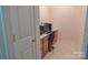 Well lit office space with built in cabinets and desk at 6222 Meadow Glen Ln, Harrisburg, NC 28075