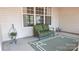 Cozy sunroom with green seating, ample natural light, and views to the outside at 6222 Meadow Glen Ln, Harrisburg, NC 28075
