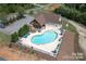 Aerial view of the neighborhood clubhouse, community pool, and ample lounge seating at 6352 Willow Farm Dr, Denver, NC 28037