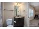 Small powder room with granite vanity and a tile floor at 6352 Willow Farm Dr, Denver, NC 28037