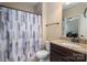 Neutral colored bathroom featuring a shower with curtain, granite vanity and a tile floor at 6352 Willow Farm Dr, Denver, NC 28037