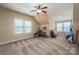 Large bedroom featuring sloped ceilings and a large window overlooking the front yard at 6352 Willow Farm Dr, Denver, NC 28037