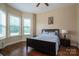 Comfortable bedroom with hardwood floors and large windows at 6352 Willow Farm Dr, Denver, NC 28037