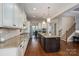 Spacious kitchen with granite countertops, stainless steel appliances, and hardwood floors at 6352 Willow Farm Dr, Denver, NC 28037