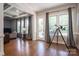 Bright living area with large windows, hardwood floors, and access to the backyard at 6352 Willow Farm Dr, Denver, NC 28037
