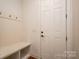 Clean mud room featuring a built-in bench and coat rack at 6352 Willow Farm Dr, Denver, NC 28037
