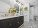 Stylish bathroom with dual vanity, gold accents, and patterned tile flooring adding a modern touch at 6724 Brushwood Dr, Charlotte, NC 28262