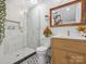 Stylish bathroom with modern vanity, glass shower, and patterned tile flooring at 6724 Brushwood Dr, Charlotte, NC 28262