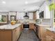 Modern kitchen with a large island, stainless steel appliances, and contemporary finishes at 6724 Brushwood Dr, Charlotte, NC 28262