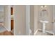 Half bath with a pedestal sink and tile flooring at 7536 Bimini Ct, Sherrills Ford, NC 28673
